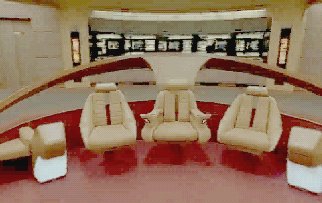 The captain's chair features armrests that incorporate miniaturized status displays.